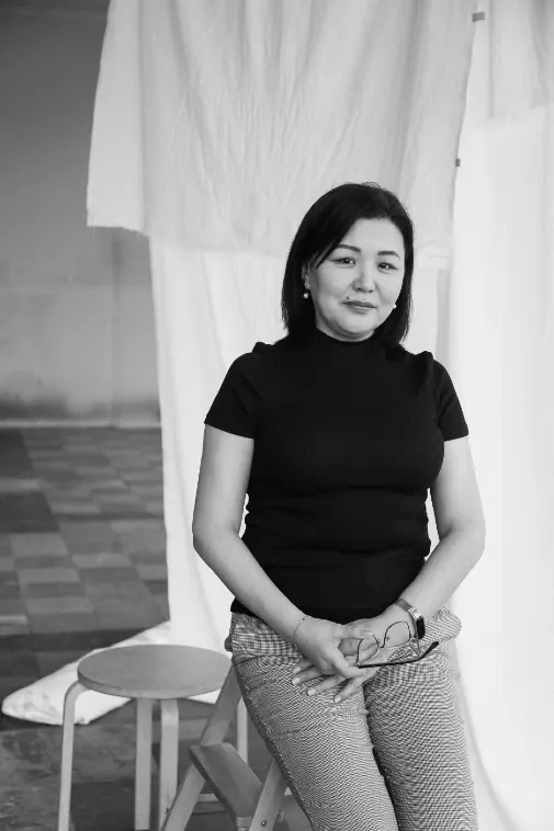 Portrait of a seamstress standing in the workshop