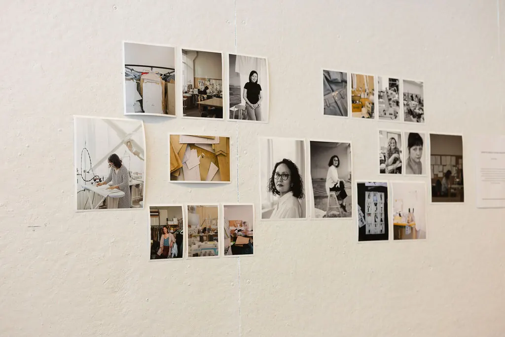 Thesis installation: photographs and text arranged on a gallery wall