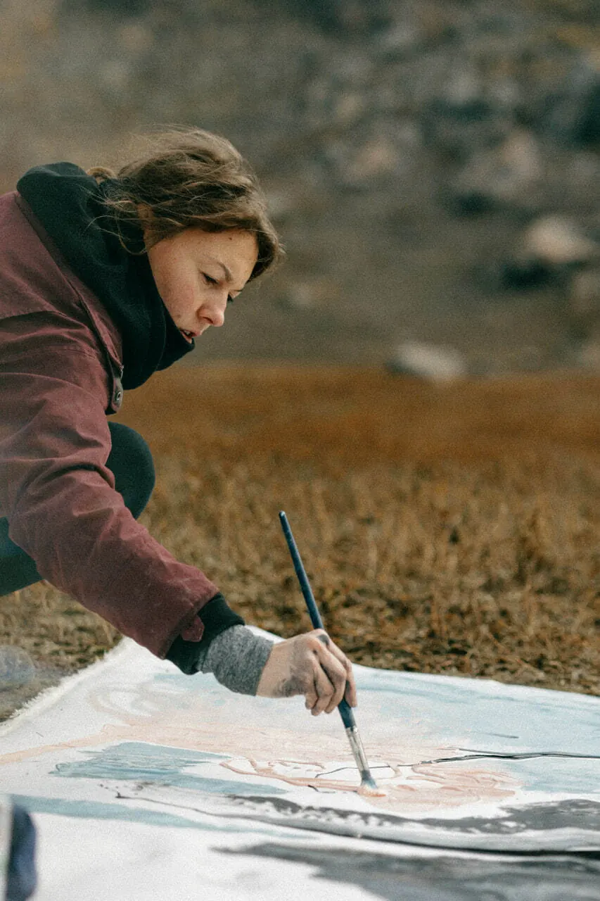 The artist painting outdoors in the steppe