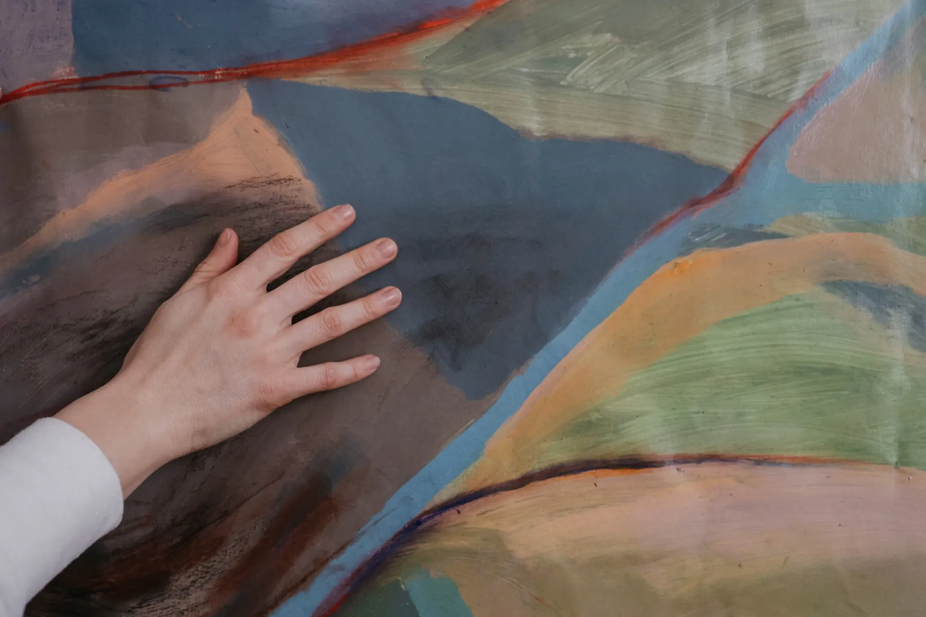 Detail of the painted landscape with a hand for scale