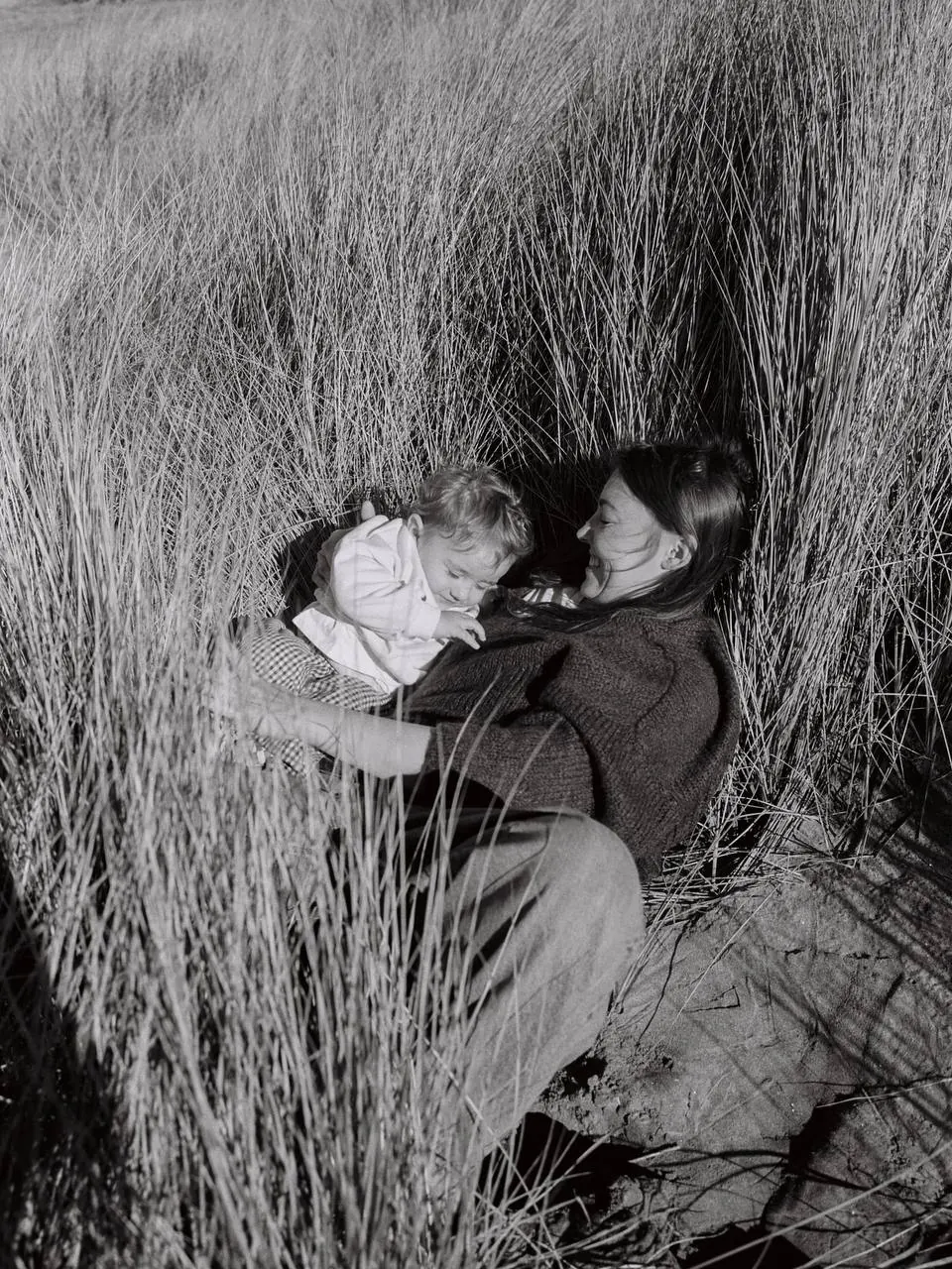 Mother and child in the beach grass